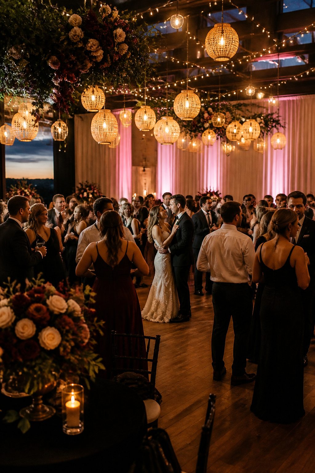 10 Cool Wedding Photo Ideas for Your 2026 Shot List 15 Reception hall illuminated with string lights and lanterns.