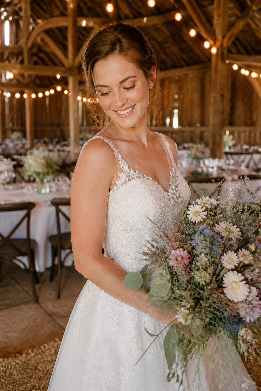 A bride with natural makeup featuring peachy tones and soft shimmer.