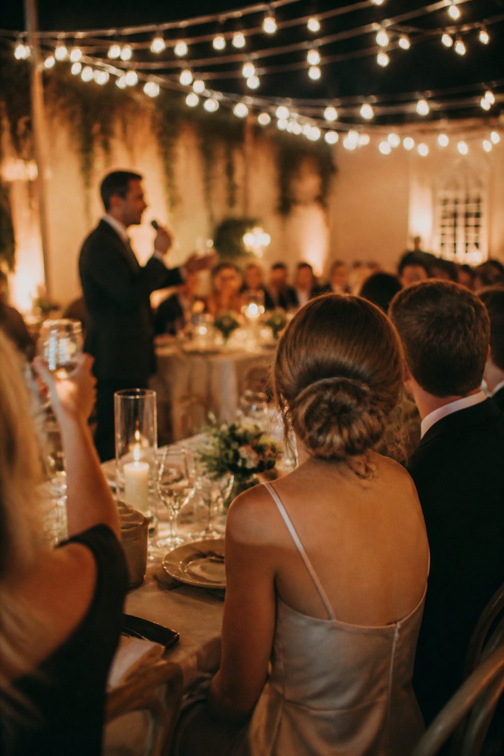 Guests celebrating and dancing at a wedding reception.