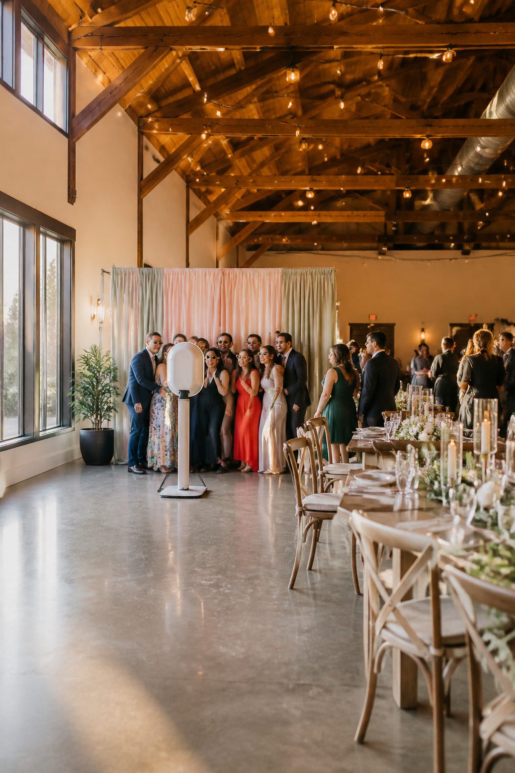 An open air photo booth with a backdrop and camera setup.