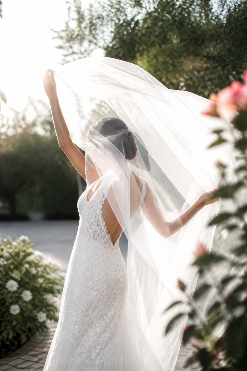 20 Wedding Photos Ideas for 2026 7 Bridal veil in motion, glowing against natural light.